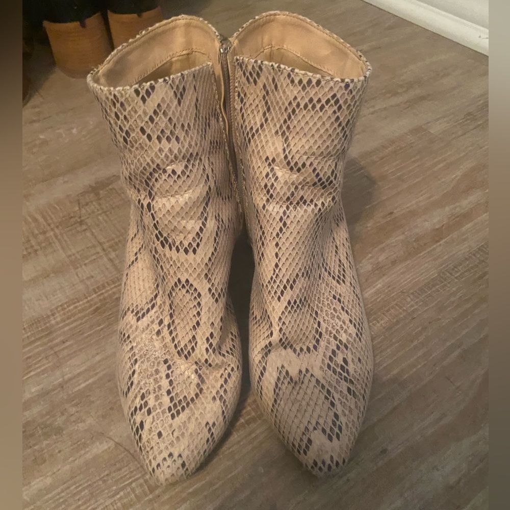 Size 8 snake print booties. In fair condition. Very comfortable!